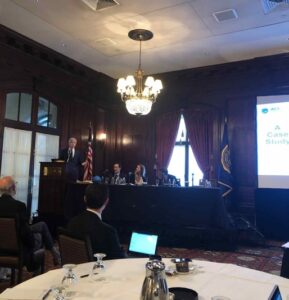 a group of people sitting at a table in a room