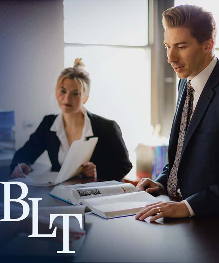 a group of people sitting at a desk